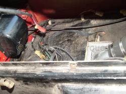 Plywood board secures tank in position